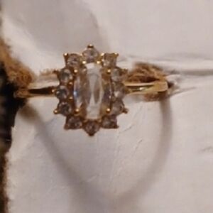 4/$60 Gold Solitaire Ring with Starburst Crystal Design